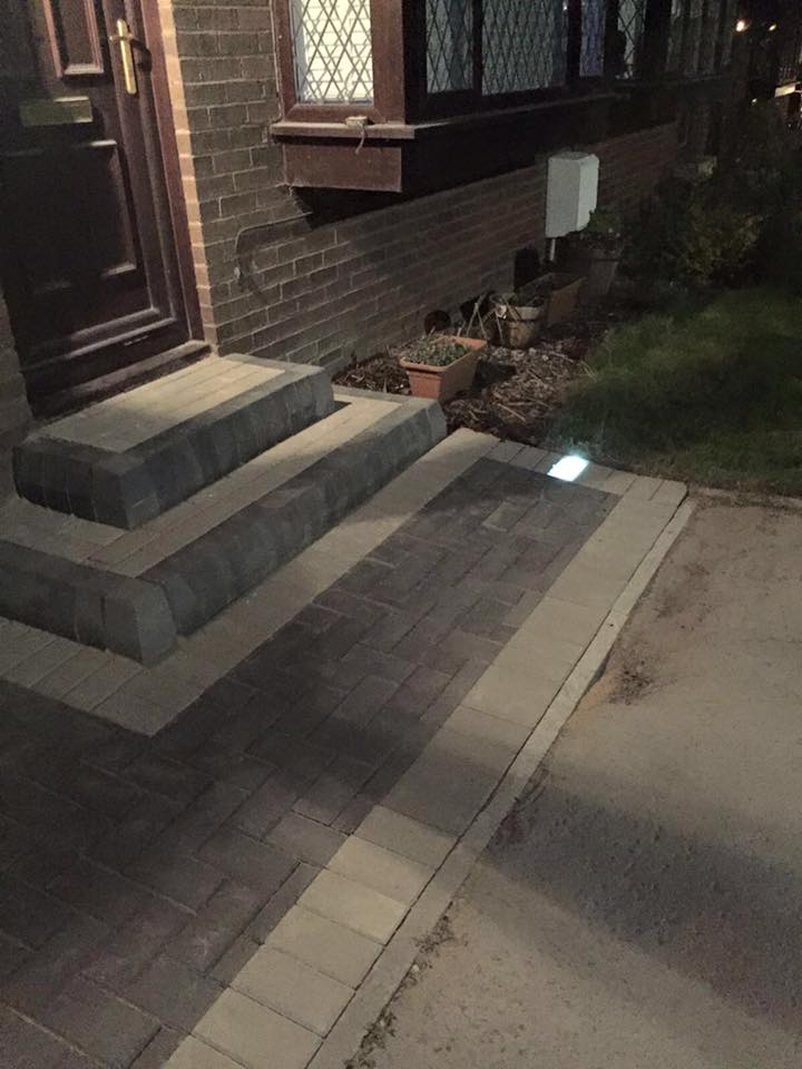 Charcoal monoblock with light grey border driveway and steps with solar power lights installed