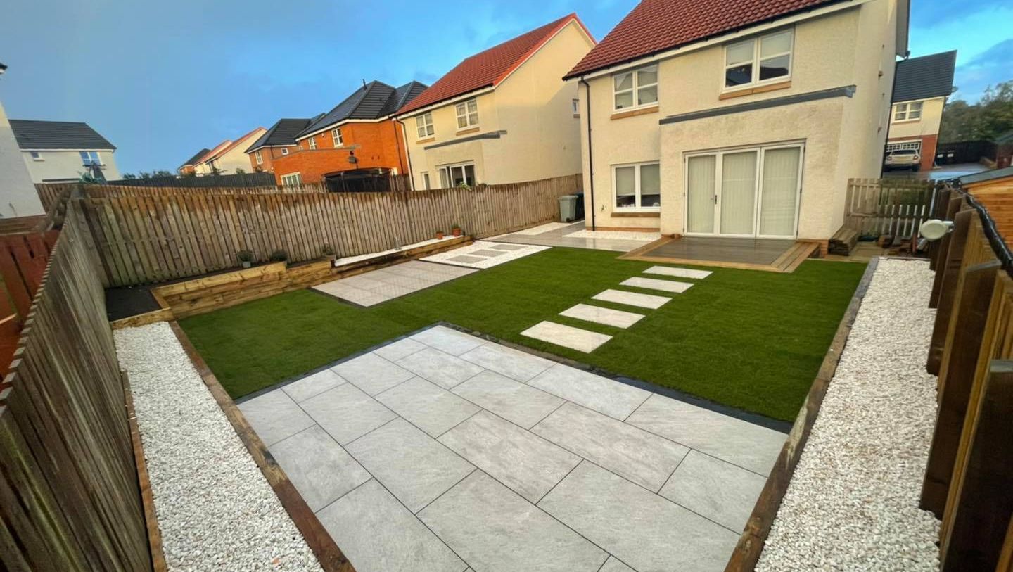 Another garden makeover using pietra sienna porcelain , sleeper retaining walls and new turf