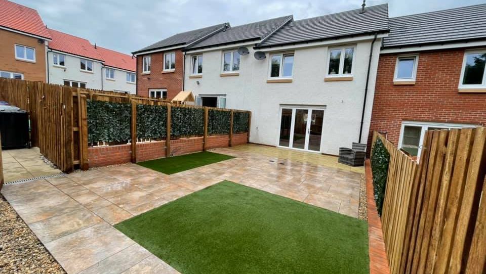 4 day makeover completed using rust porcelain & artificial grass 