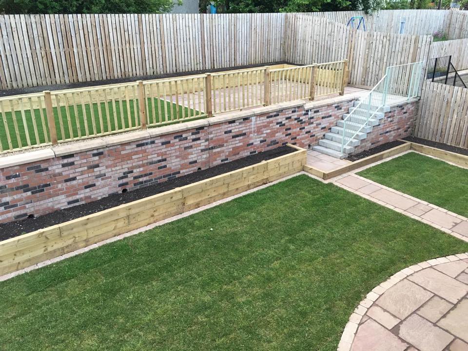 Large garden project complete. Over 100 tonnes of dirt taken of out creating two level areas and installing artificial turf, natural turf, timber sleeper retaining and flower beds, Indian sandstone patios, cobble borders.