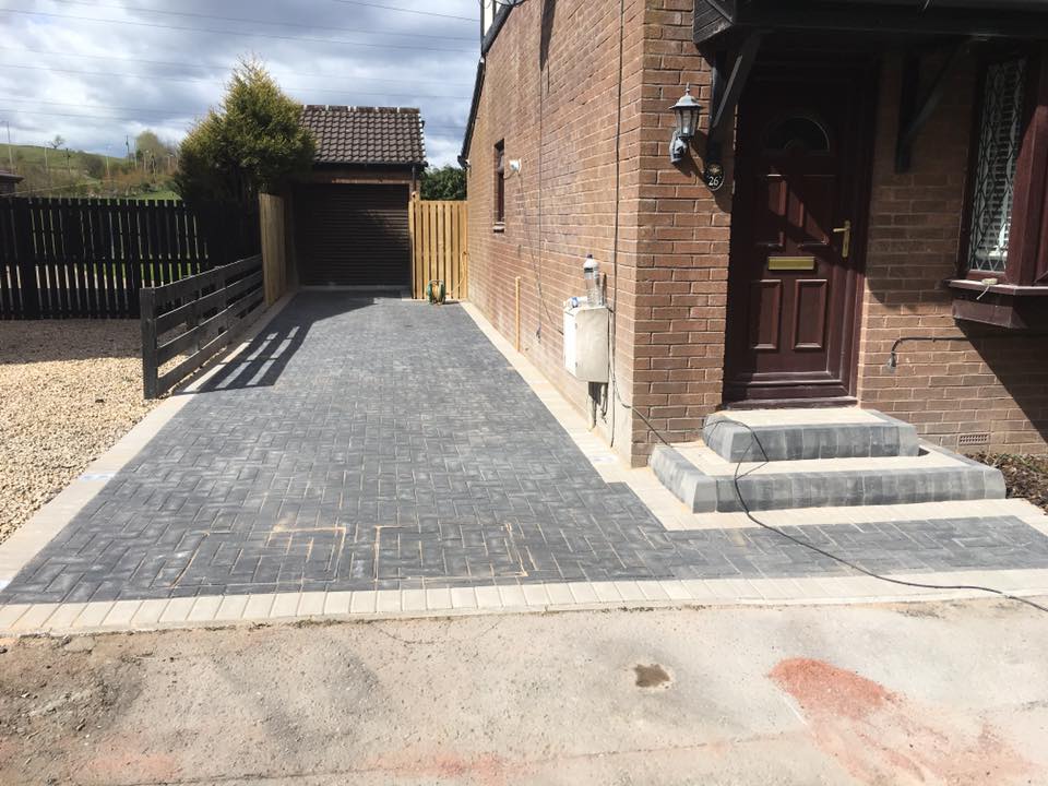 Charcoal monoblock with light grey border driveway and steps with solar power lights installed