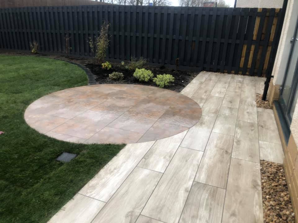 Job complete in Uddingston. This one was all about the soft lines and curves, with a mixture of two styles of porcelain, used and cut to create two circle patio areas with separate paths.